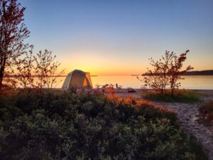 Tent Camping at Sunset Tent camping at sunset during a road trip adventure